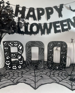 Black BOO Letters Decorated with white Pumpkin Faces, Spider Webs & Ghosts. Halloween Party Sign Decor. Freestanding Letters