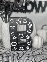 Load image into Gallery viewer, Black Letter B Decorated with white Pumpkin faces. Handmade Halloween Decor. Freestanding Letters
